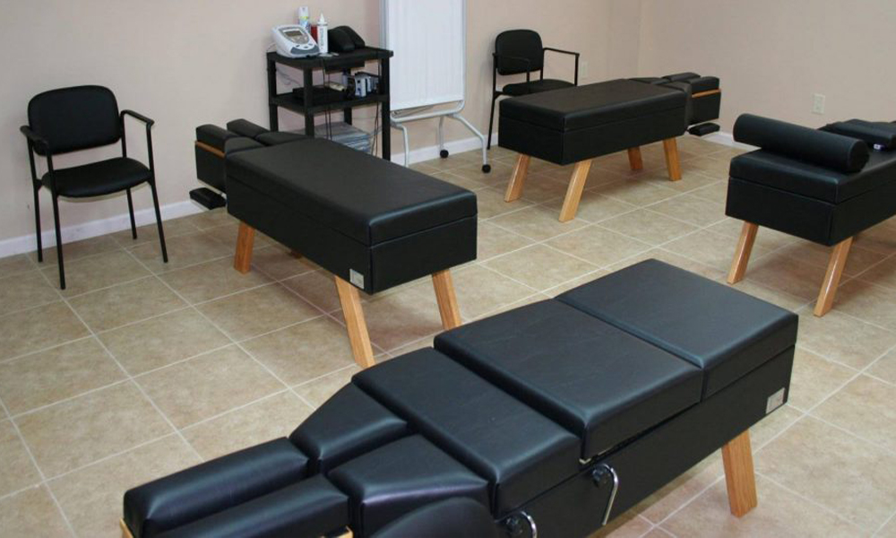 Treatment room with chiropractic adjustment tables
